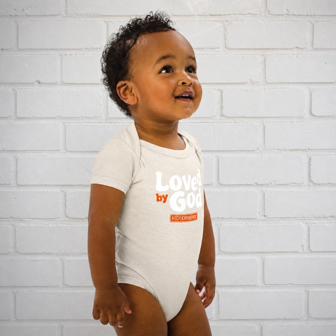 KE LOVED BY GOD ONESIE